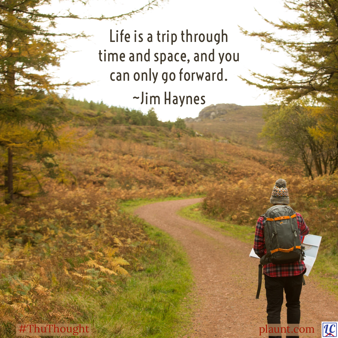 A hiker stopped on a gravel path through hilly terrain. She is looking at a map. Caption: Life is a trip through time and space, and you can only go forward. ~Jim Haynes