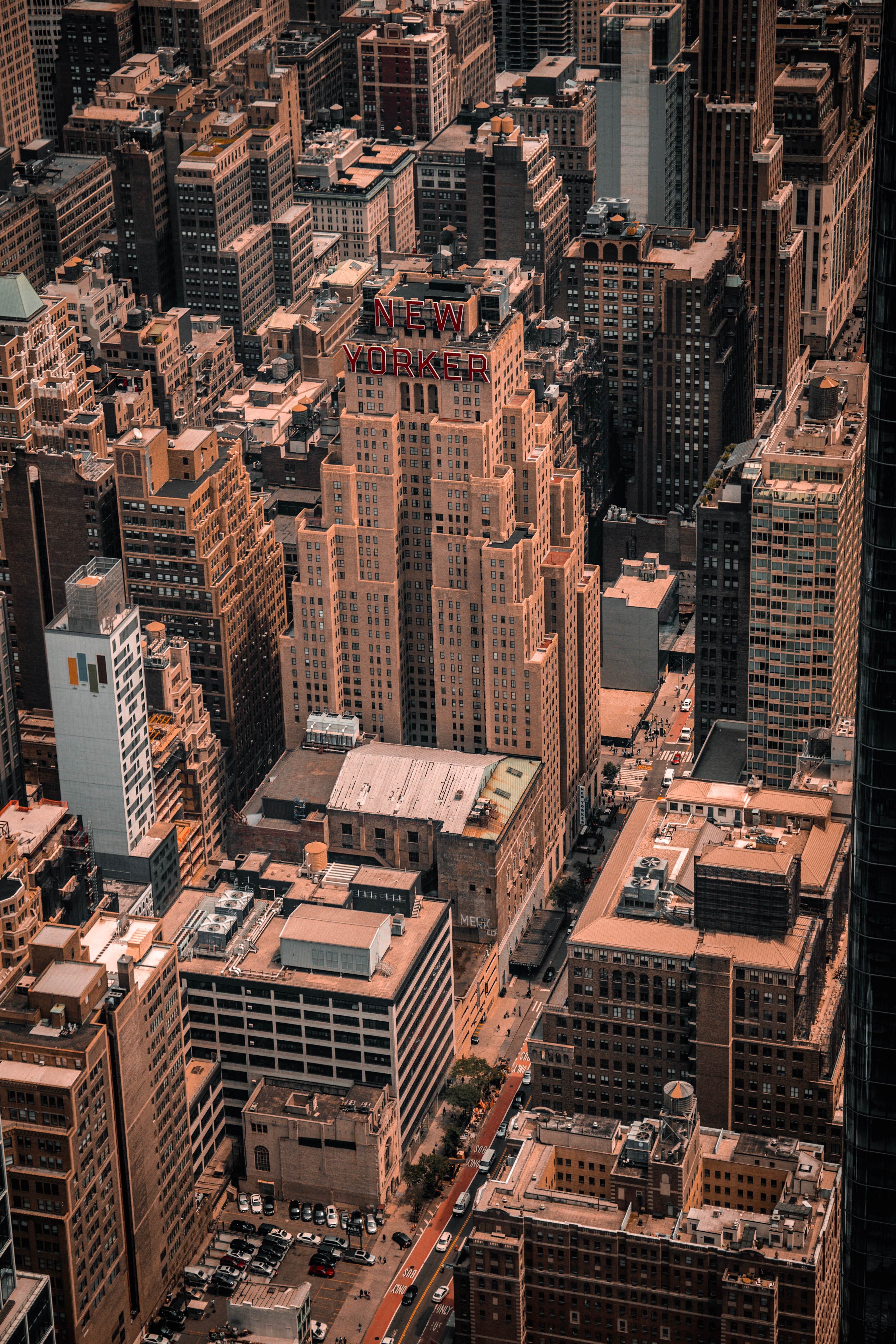 Tall, light brown, multi-level buildings crowded together in New York.